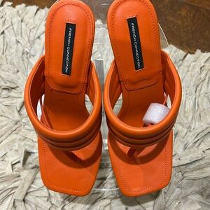 NWOT orange mules ready to style with a sundress or pant set .  Very nice style